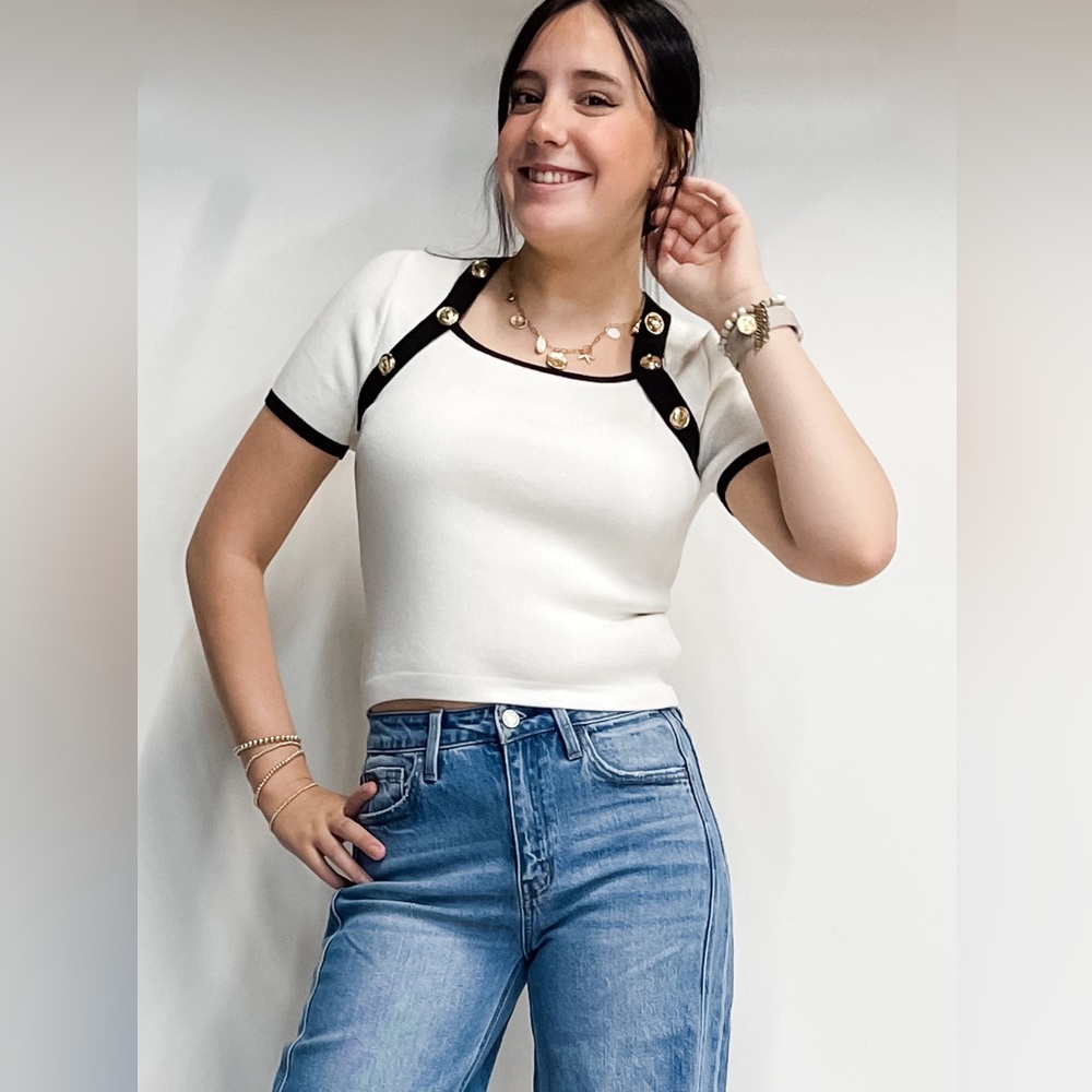 Entro fitted cream knit short sleeve top with gold accent buttons and black trim